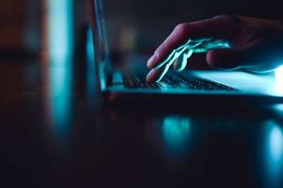 Hands typing on a keyboard