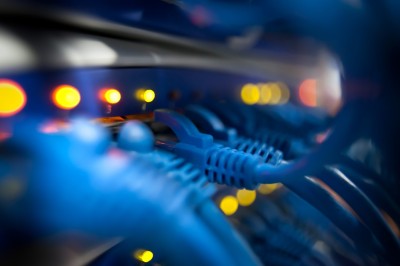 Network cables plugged into a glowing box